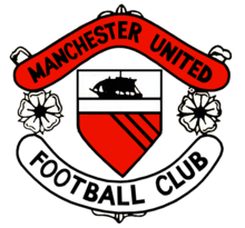 A football crest. In the centre is a shield with a ship in full sail above a red field with three diagonal black lines. Either side of the shield are two stylised roses, separating two scrolls. The upper scroll is red and reads "Manchester United" in black type, while the lower scroll is white with "Football Club" also written in black.