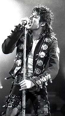 Black-and-white photograph of Michael Jackson performing live in 1988.
