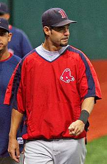 Mike Lowell in a Red Sox jacket and cap