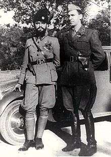 two men in uniform leaning against a car