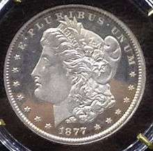 A coin depicting the profile of a young woman