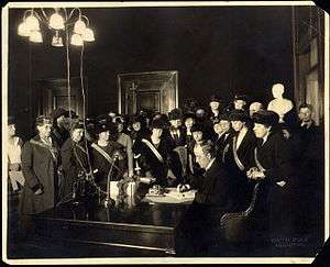 Governor Edwin P. Morrow signs ratification bill for Kentucky, January 6, 1920, with members of the Kentucky Equal Rights Association watching.