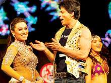 Rani Mukerji and Shah Rukh Khan are seen dancing on stage