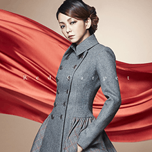 A body shot of a Japanese woman (Namie Amuro), with a large red silky fabric in the background. The song and artist title is superimposed on her.