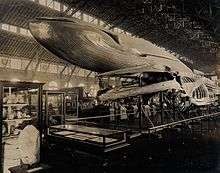 Natural History exhibit at the 1904 World's Fair, St. Louis, featuring a blue whale model and a dinosaur skeleton