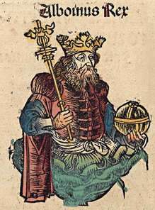 An image of a bearded man with a crown and a sceptre in one hand and a globe cruciger in the other