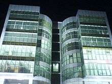 Glass-block office building at night