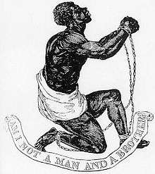 Drawing which shows a slave kneeling and holding up his clasped and manacled hands. Underneath him, a banner says "Am I Not a Man and a Brother?"