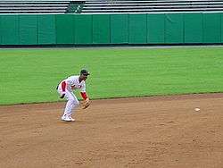 Baseball great is seen fielding a ground ball on a dirt infield
