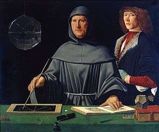 A painting of two men. The man at the center is looking off to his right while drawing a symbol with his right hand. His left hand is resting on a page in a book. He is wearing a robe with a hood. The man on the right is looking towards the front and is wearing a long-sleeve red shirt with a black jacket. Several writing utensils and books are on a table with a green tablecloth in the front of the image.