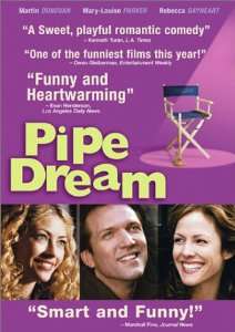 "Pipe Dream" is written in yellow next to a movie set folding chair. Below are three photos, side by side, of smiling thirty-somethings : a blonde woman, a man and a dark-haired woman.