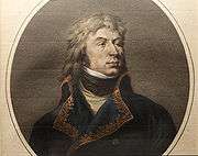 Print depicts a defiant-looking man with shoulder-length hair and a cleft chin. He wears a blue French military coat of the 1790s.