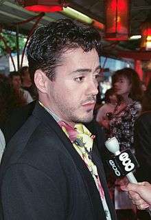 Robert Downey Jr. facing right in 1990 at a film premiere for his movie Air America