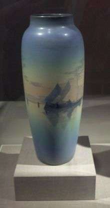 Photo of a tall blue Rookwood vase made by Carl (Charles) Schmidt ca. 1904, on display at the De Young Museum in San Francisco