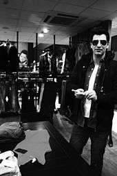 Man in sunglasses in a clothing store