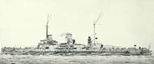 A large gray battleship moves slowly through calm seas