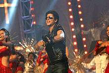 Shah Rukh Khan dances with other performers in 2010