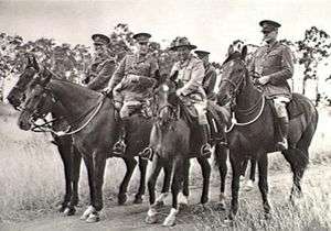 A group of five senior military personnel on horseback.