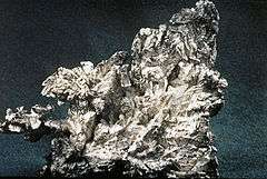 An irregularly shaped specimen of native silver ore.