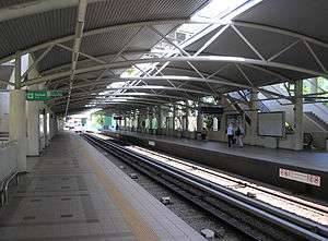 A platform area in a bright new railway station.