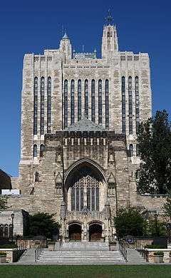 Facade and tower of Sterling Memorial Library at middle distance, from Yale University's Cross Campus.