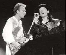 Sting and Bono performing a duet of the Police song, "Invisible Sun" at the Conspiracy of Hope concert on June 15, 1986 at Giants Stadium.