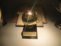 Football-shaped trophy, mounted on a base