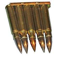 five cartridges held together at their bases by a strip of metal