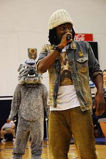 Wale rapping on stage