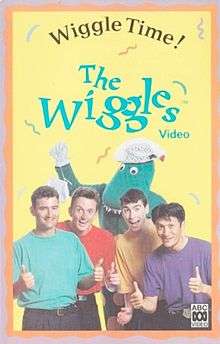 Cover showing four of The Wiggles doing there thumbs up with Dorothy the Dinosaur at the back holding her bag.