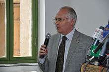 Canadian Ambassador William Crosbie makes remarks during the opening of the refurbished Turquoise Mountain Foundation in Kabul on May 9, 2011.