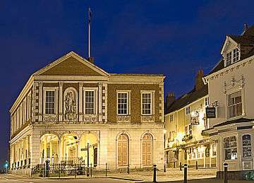 The south side of Windsor Guildhall at night showing Wren's open ground floor and 1829 extension.